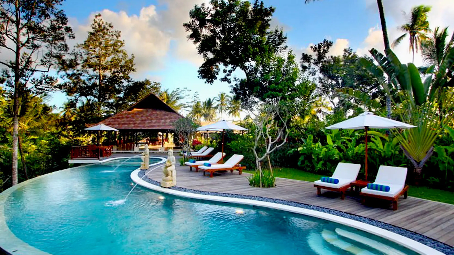 Lush tropical garden pathway at BeingSattvaa retreat in Bali